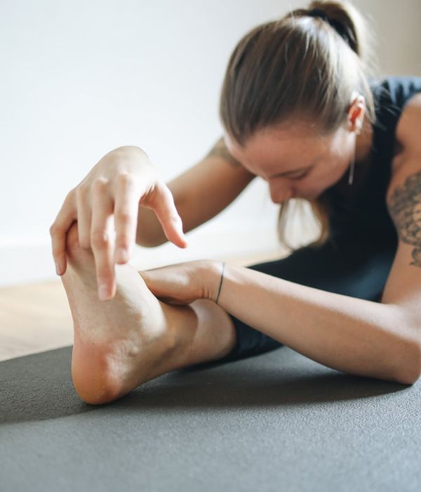 Woman practicing visual focus techniques in a calm dark environment.